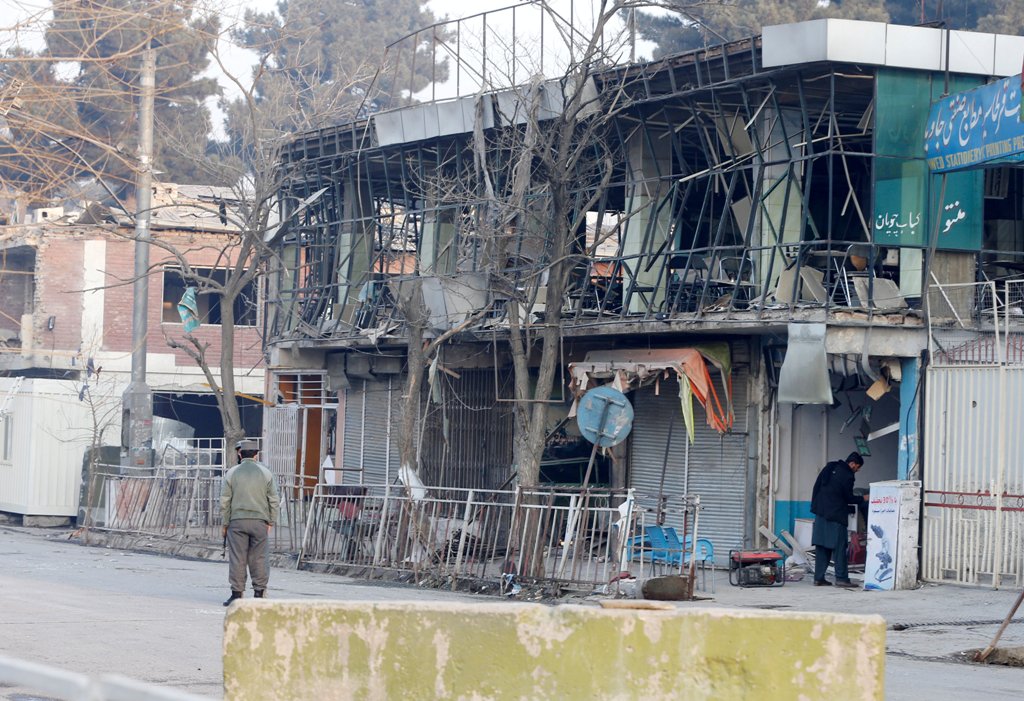 Afghan policemen inspect the site of a bomb attack in Kabul, Afghanistan, January 28, 2018. REUTERS/Omar Sobhani
