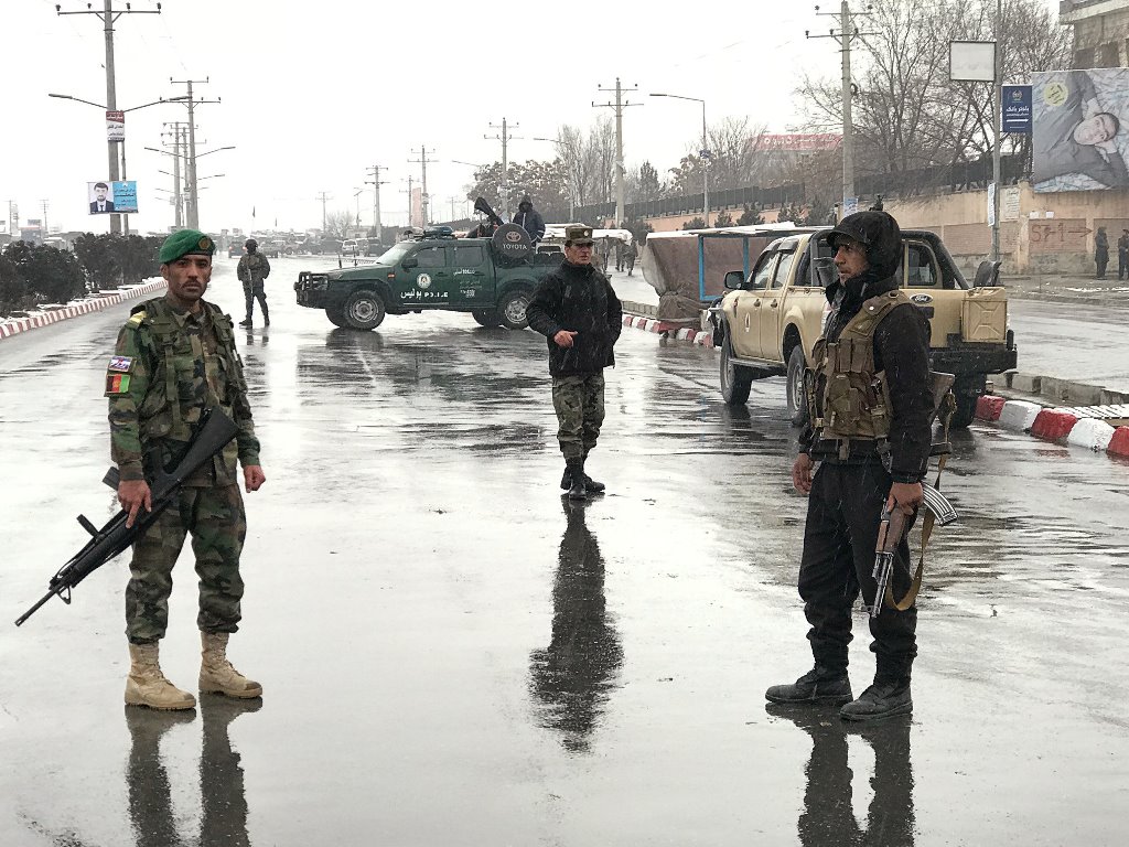 Afghan security forces stand near the Marshal Fahim military academy after a series of explosions in Kabul, Afghanistan January 29, 2018. REUTERS/Mohammad Ismail	
