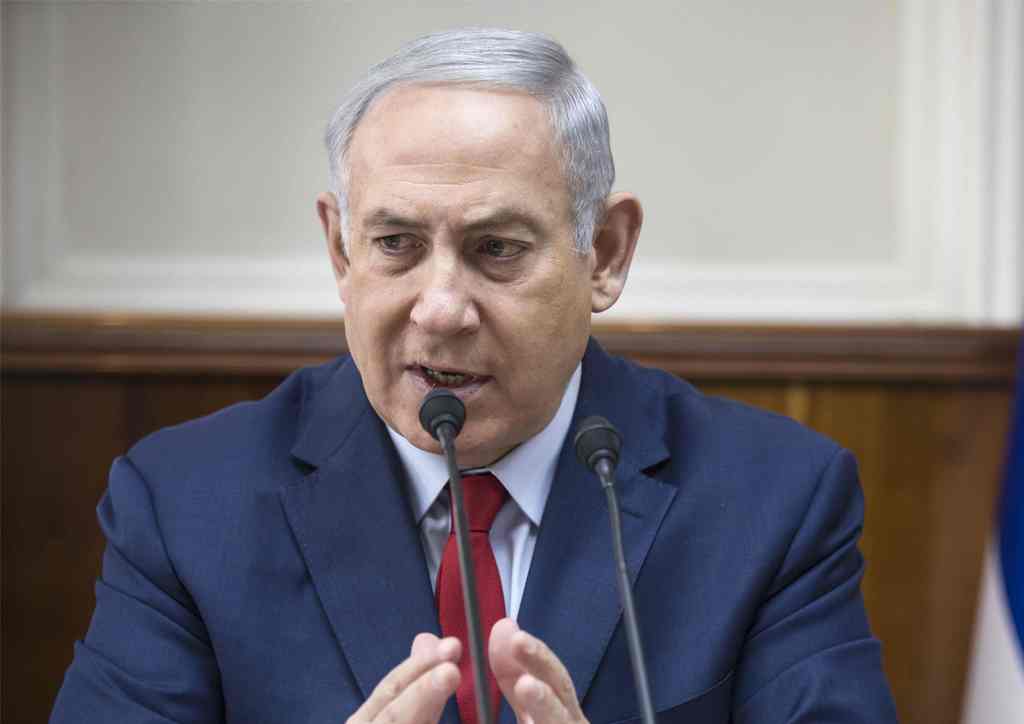 Israeli Prime Minister Benjamin netanyahu speaks during a cabinet meeting in Jerusalem on January 28, 2018. / AFP / POOL / Tsafrir Abayov
