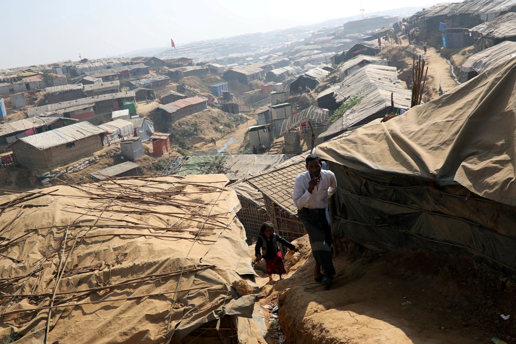File photo of Rohingya refugees walk along the Kutupalong refugee camp in Cox's Bazar, Bangladesh, January 21, 2018. REUTERS/Mohammad Ponir Hossain/File Photo
