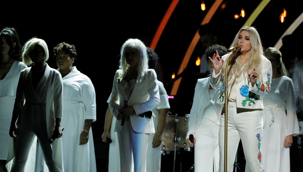 Kesha (R), Cyndi Lauper (C) and Bebe Rexha (L) perform 