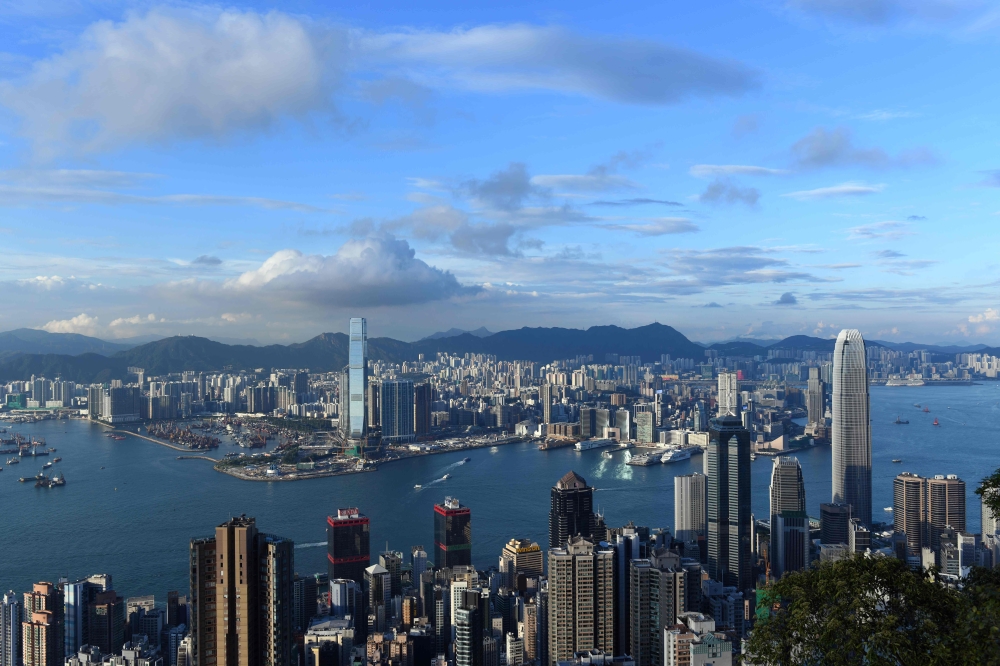 (FILES) General view of the skylines of the Kowloon district (back) and Hong Kong Island (foreground) from Victoria Peak.  AFP / Anthony WALLACE