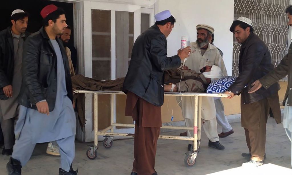 Pakistani relatives transport an injured blast victim at a hospital in Kurram tribal district on January 30, 2018. AFP 