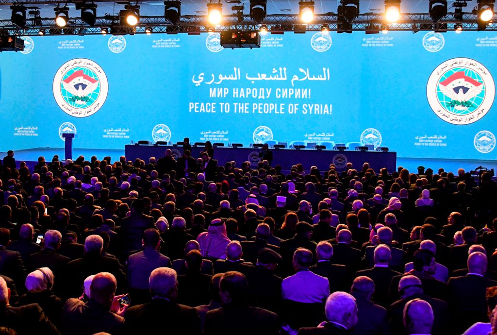Attendees wait for the start of a plenary session at the Congress of Syrian National Dialogue in Sochi on January 30, 2018. / AFP / Alexander NEMENOV
