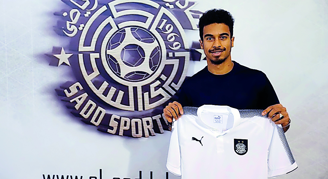 Akram Afif poses with the Al Sadd shirt  during his unveiling ceremony in Doha yesterday.