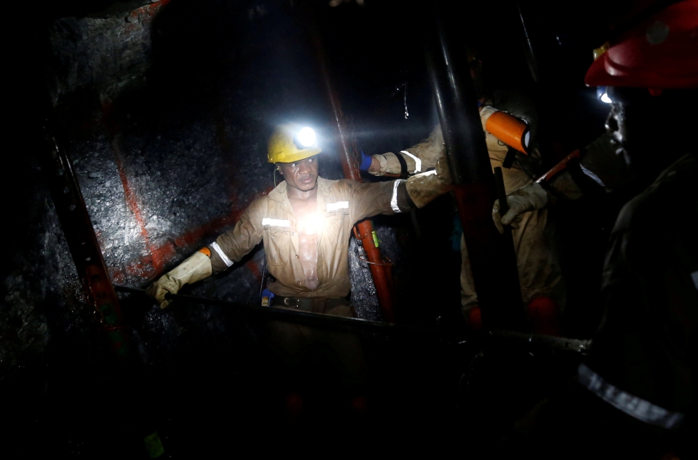 Miners work deep underground at Sibanye Gold's Masimthembe shaft in Westonaria, South Africa, April 3, 2017. Reuters/Mike Hutchings