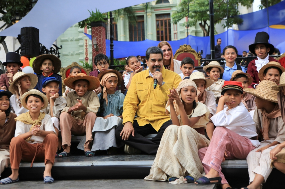 Venezuela's President Nicolas Maduro (C) attends an event with supporters at Plaza Bolivar square in downtown Caracas, Venezuela February 1, 2018. Miraflores Palace/ Reuters