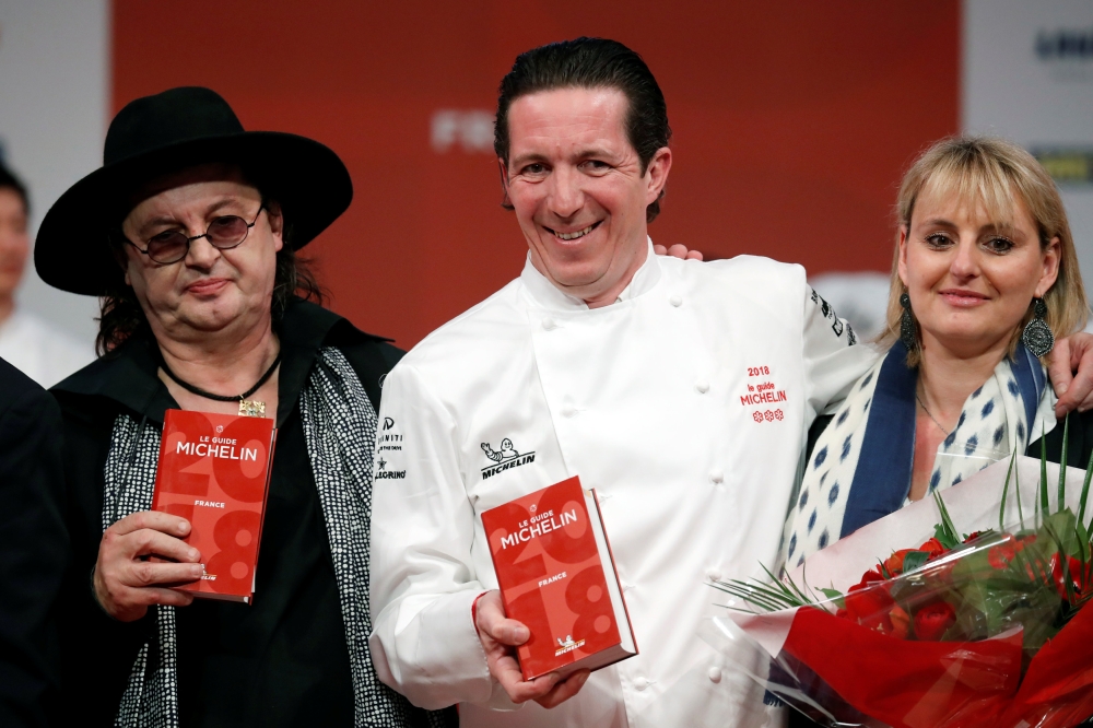 From L-R, French chef Marc Veyrat, awarded with three Michelin stars for his restaurant La Maison des Bois in Manigod, French chef Christophe Bacquie, awarded with three Michelin stars for his restaurant Hotel du Castellet in the Var region, and his wife 