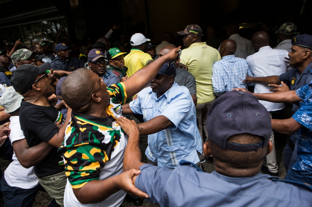  African National Congress (ANC) supporters are held back by the South African Police Service outside Luthuli House, the ANC headquarters, after supporters of the Black First Land First (BLF) movement handed a memorandum to the ANC secretary general in su