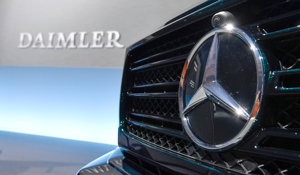 The Mercedes-Benz star is displayed on the front of a Mercedes-Benz G-model at the annual press conference of German auto giant Daimler AG in Stuttgart, southwestern Germany, on February 1, 2018.  AFP / THOMAS KIENZLE