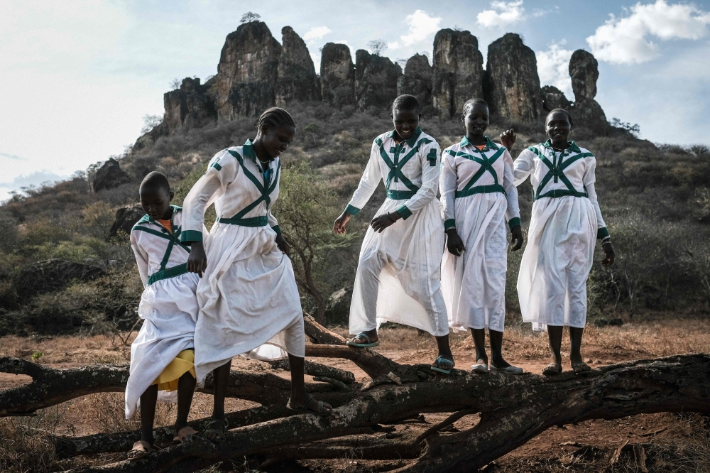 Pokot tribe teen age girls, who don't practice female genital mutilation (FGM), pose in church uniform at Katabok village in the northeast of Uganda, on January 30, 2018. AFP / Yasuyoshi Chiba