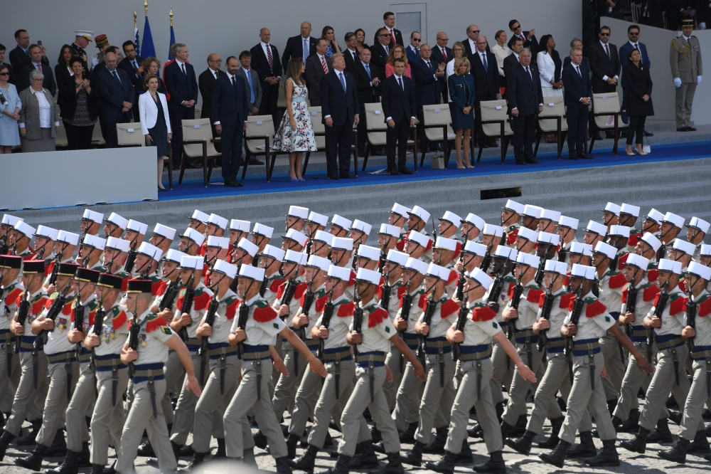 In this file photo taken on July 14, 2017 (FromL) French Defence Minister Florence Parly, French Prime Minister Edouard Philippe, US First Lady Melania Trump, US President Donald Trump, French President Emmanuel Macron and his wife Brigitte Macron, French