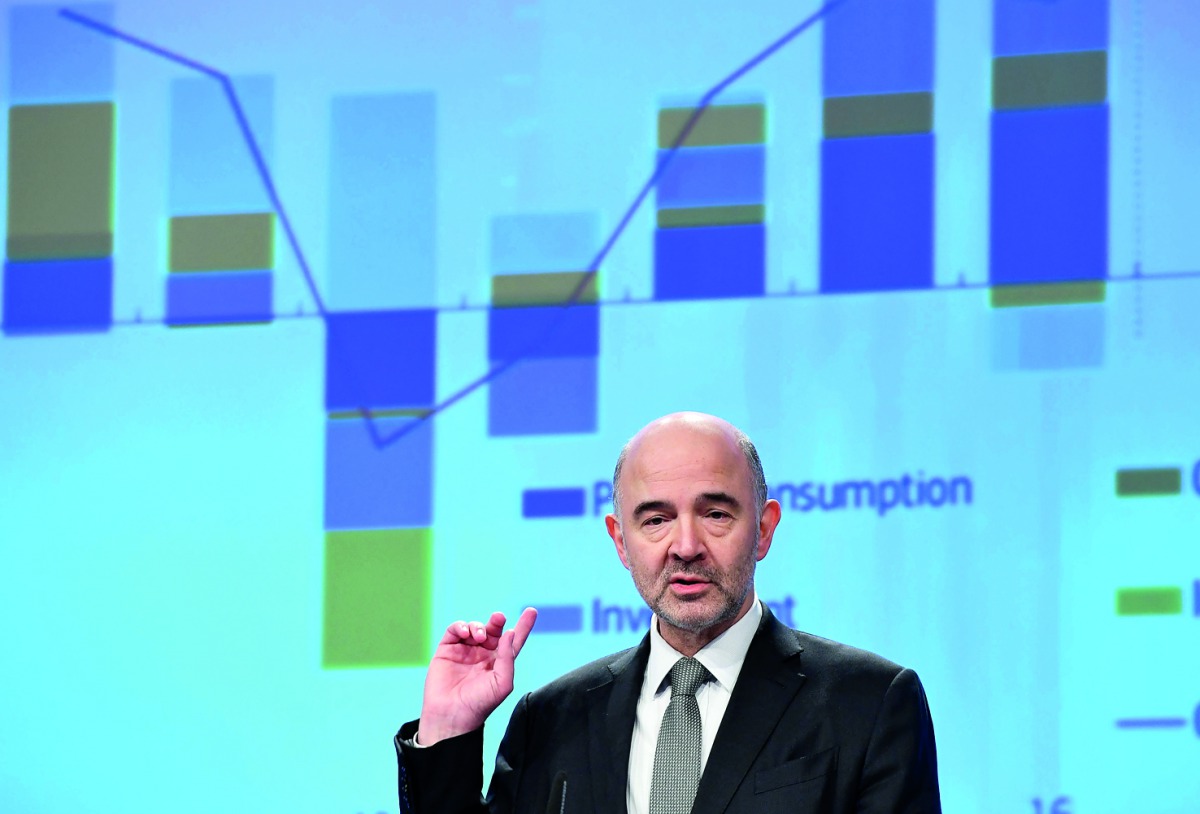 European Commissioner for Economic and Financial Affairs, Taxation and Customs Pierre Moscovici gestures as he presents the EU Winter 2018 Interim Economic Forecast at the European Commission in Brussels on February 7, 2018. AFP / Emmanuel Dunand