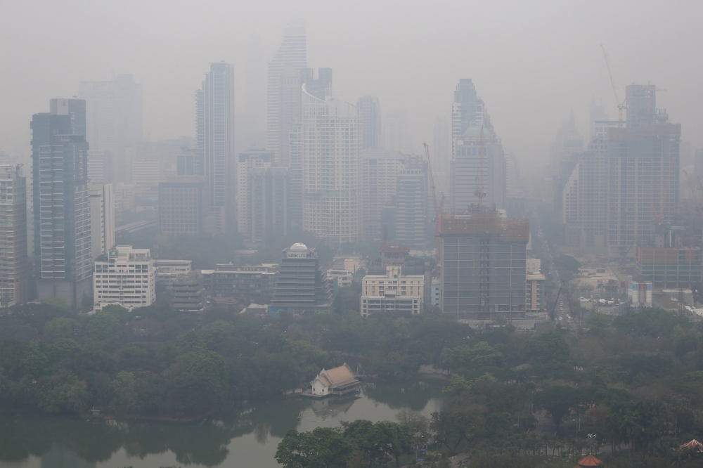 The skyline is seen through morning air pollution in Bangkok, Thailand February 8, 2018. REUTERS/Athit Perawongmetha