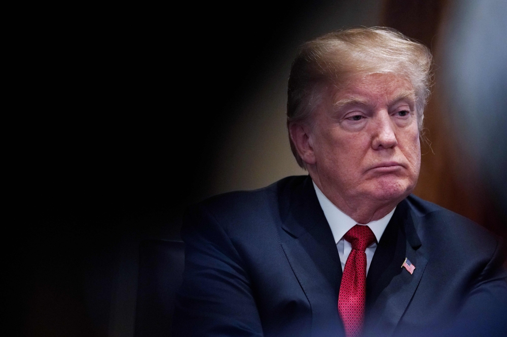 (FILES) In this file photo taken on February 06, 2018 US President Donald Trump attends a roundtable discussion on the MS-13 gang in the Cabinet Room of the White House in Washington, DC. AFP / MANDEL NGAN