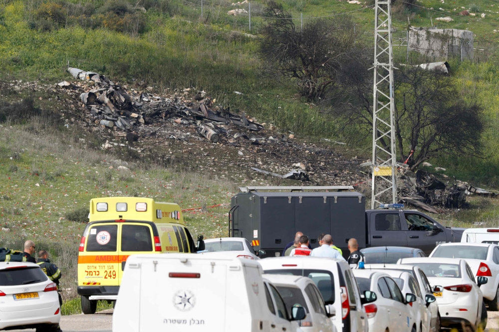 A picture taken in the northern Israeli Kibbutz of Harduf on February 10, 2018, shows the remains of an Israel F-16 that crashed after coming under fire by syrian air defences during attacks against 