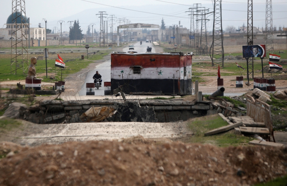 A checkpoint held by Syrian forces loyal to President Bashar al-Assad is pictured in Aleppo, Syria February 10, 2018. REUTERS/Omar Sanadiki

