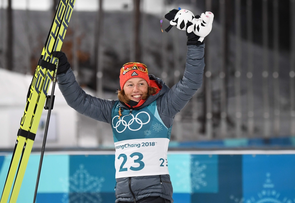 Germany's Laura Dahlmeier celebrates after wining gold in the women's 7,5 km sprint biathlon event during the Pyeongchang 2018 Winter Olympic Games on February 10, 2018, in Pyeongchang. (AFP / FRANCK FIFE)