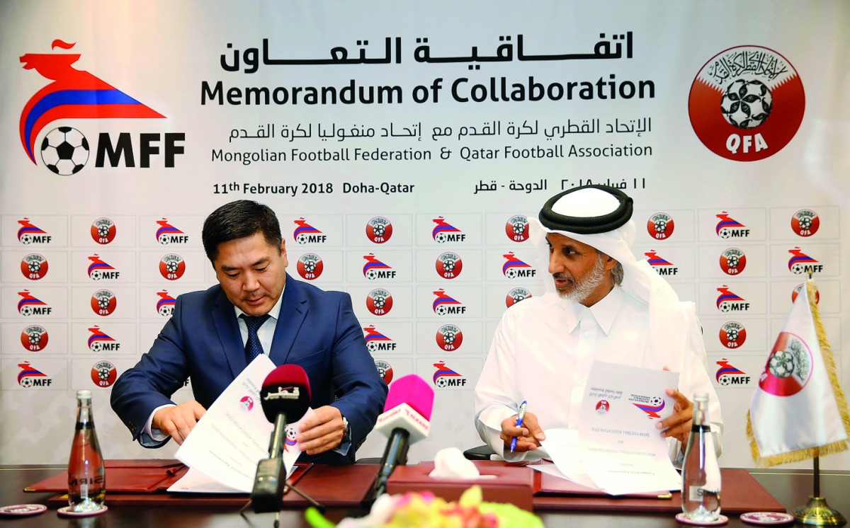 Sheikh Hamad bin Khalifa bin Ahmed Al Thani, President of the Qatar Football Association and Qatar Football Association President, Ganbaatar Amgalanbaatar sign cooperation agreement towards a better future for football in Doha yesterday