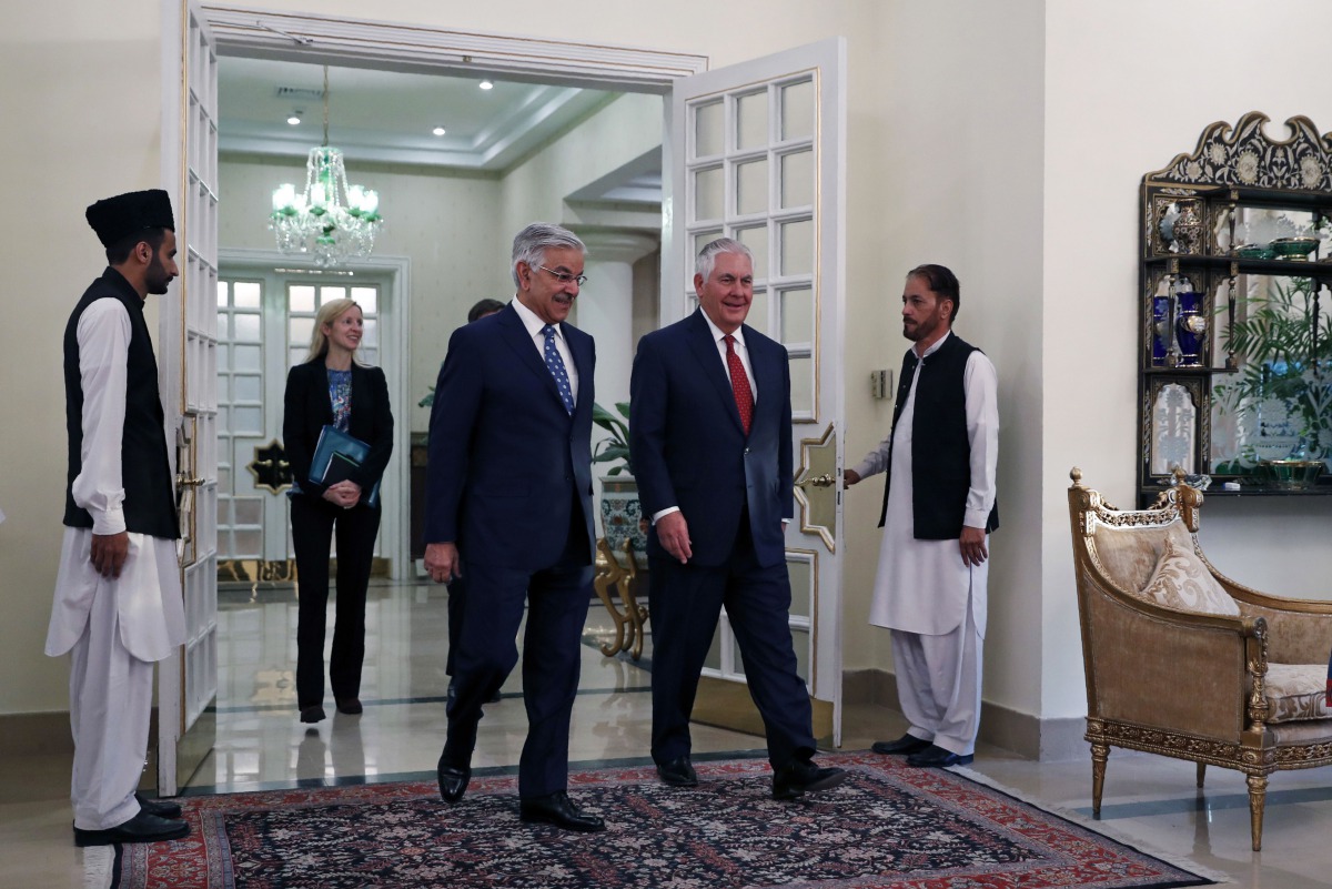 US Secretary of State Rex Tillerson walks with Pakistani Foreign Minister Khawaja Asif as he arrives at the Prime Ministers residence in Islamabad on October 24, 2017. 
(AFP / Alex Brandon) 