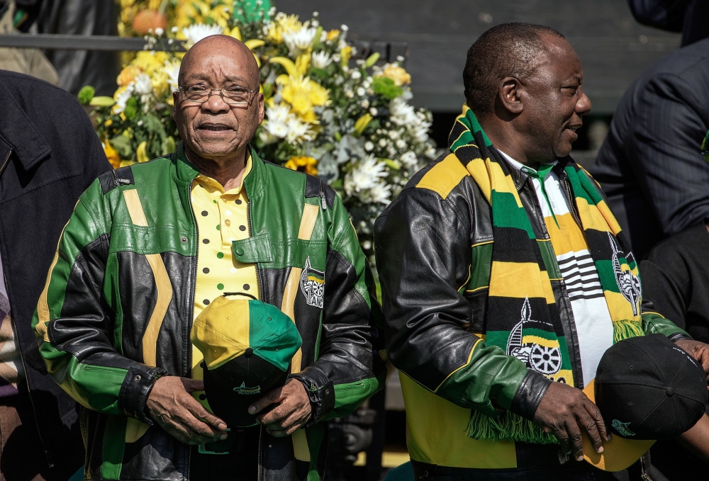 In this file photo taken on July 31, 2016 South African ruling party African National Congress (ANC) president Jacob Zuma (L) and deputy Cyril Ramaphosa arriving for the ANC closing rally campaign for the municipal elections at Ellis Park Stadium in Johan