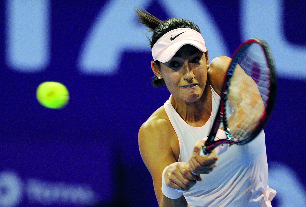 France’s Caroline Garcia returns the ball to Slovakia’s Dominika Cibulkova during their second round match of the Qatar Total Open at the Khalifa International Tennis and Squash Complex yesterday. Pic: Salim Matramkot/ The Peninsula