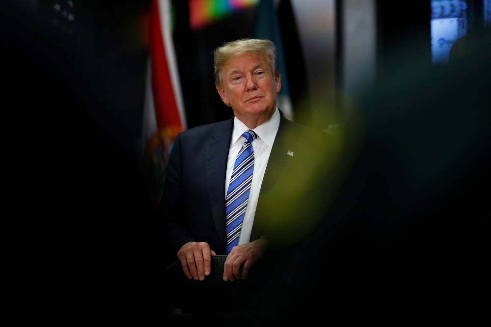 US President Donald Trump meets with law enforcement at the Broward County Sheriff's Office in the wake of the shooting at Marjory Stoneman Douglas High School in Fort Lauderdale, Florida, U.S., February 16, 2018. REUTERS/Eric Thayer