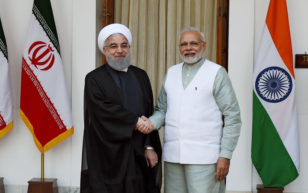Iranian President Hassan Rouhani (L) shake hands with Indian Prime Minister Narendra Modi before a meeting at Hyderabad house in New Delhi on February 17, 2018. AFP / MONEY SHARMA
