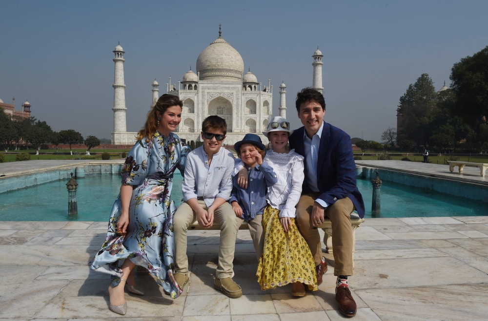 Prime Minister of Canada Justin Trudeau, his wife Sophie Gregoire and his children pose for a photograph during their visit to Taj Mahal in Agra on February 18, 2018. (AFP / MONEY SHARMA)