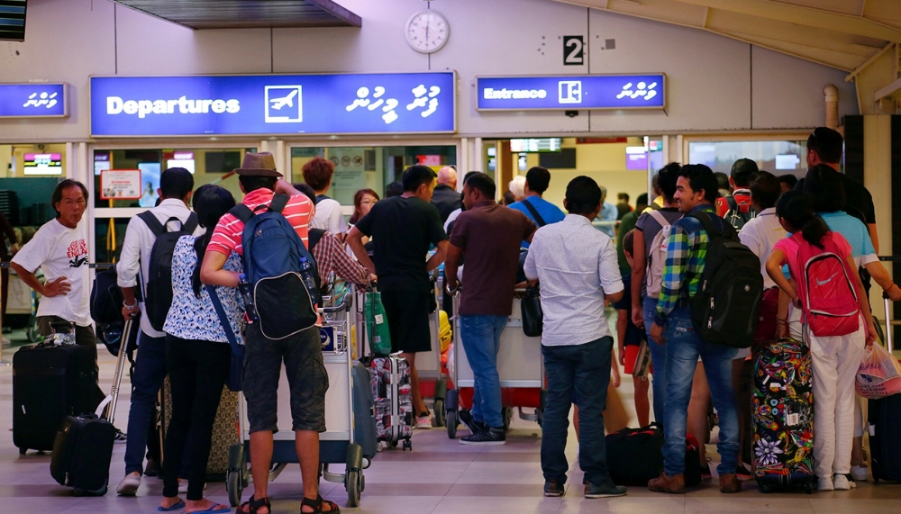 Tourists wait in the departures hall at Velana International Airport in Male, Maldives February 13, 2018. Reuters/Stringer