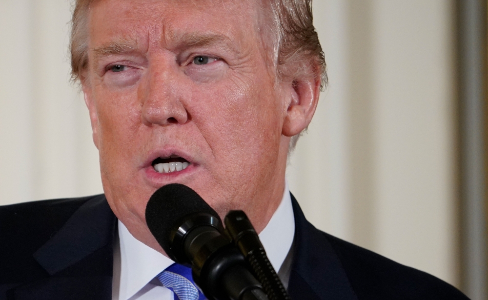 US President Donald Trump speaks during the Public Safety Medal of Valor Awards Ceremony in the East Room of the White House on February 20, 2018 in Washington, DC. / AFP / MANDEL NGAN