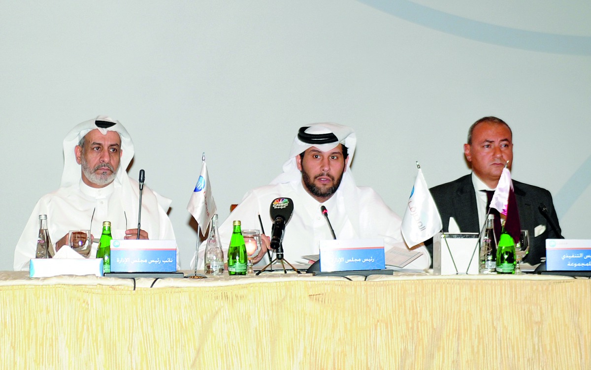 Sheikh Jassim bin Hamad bin Jassim bin Jaber Al Thani (centre) Chairman , QIB; Abdullatif bin Abdulla Al Mahmoud (left), Vice Chairman, QIB; and Bassel Gamal, CEO of the bank, during  QIB Ordinary and Extraordinary General Assembly meeting, yesterday. Pic