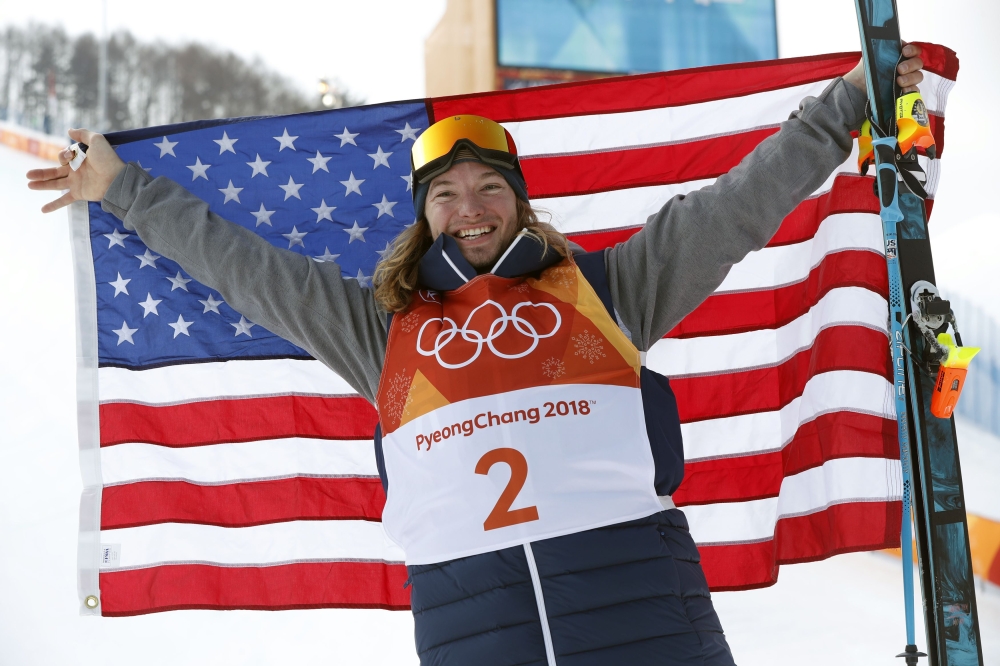 Gold medallist David Wise of the U.S. celebrates during flower ceremony, February 22, 2018. REUTERS/Issei Kato
