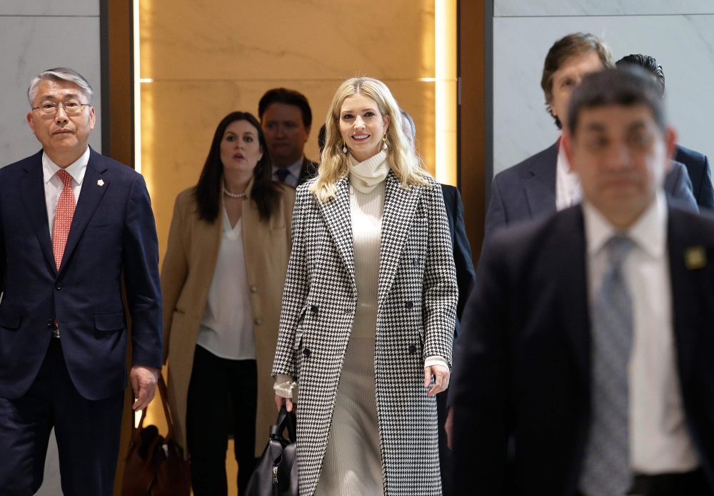 Ivanka Trump (C), advisor to and daughter of US President Donald Trump, arrives at Incheon International Airport in Incheon on February 23, 2018, to attend the closing ceremony of the 2018 Pyeongchang Winter Olympic Games on February 25. / AFP / POOL / Ah
