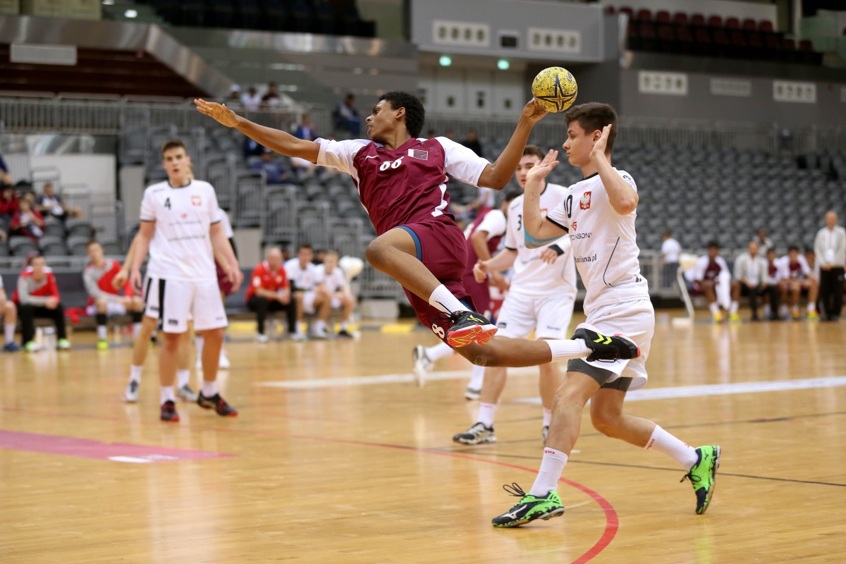 A Qatari player successfully shoots to score a goal against Poland in the Group A boys match of the 24th ISF World Schools Handball Championships at the Ali bin Hamad Al Attiyah Stadium in Al Sadd yesterday.