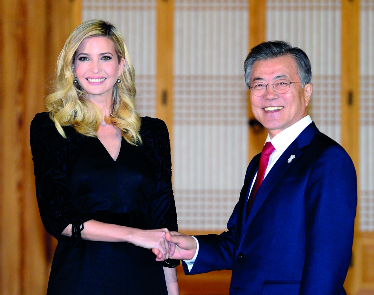 South Korean President Moon Jae-In (R) shakes hands with Ivanka Trump during their dinner meeting at the Presidential Blue House in Seoul on February 23, 2018. AFP  / Kim Min-Hee