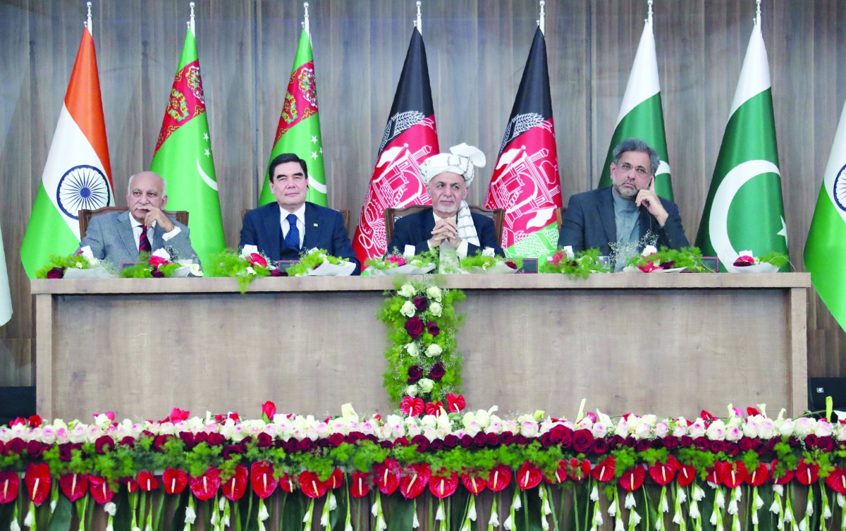Afghan President Ashraf Ghani (C) with Gurbanguly Berdymukhamedov President of Turkmenistan (2L), Pakistani Prime Minister Shahid Khaqan Abbasi (R) and India's External Affairs Minister Shri M. J. Akbar (L) look on during the (TAPI) gas pipeline project i