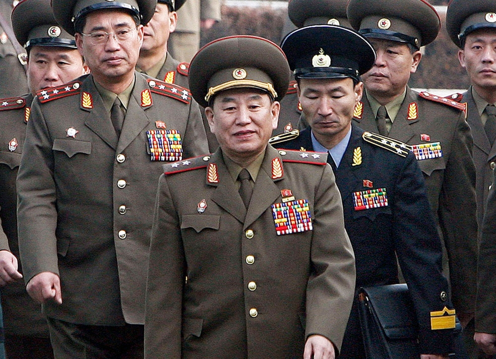 (FILES) This file picture taken on December 13, 2007 shows North Korea's chief delegate Kim Yong Chol (C) and North Korean soldiers crossing the border which divides the two Koreas to attend the inter-Korean general talks at the South's side of the truce 