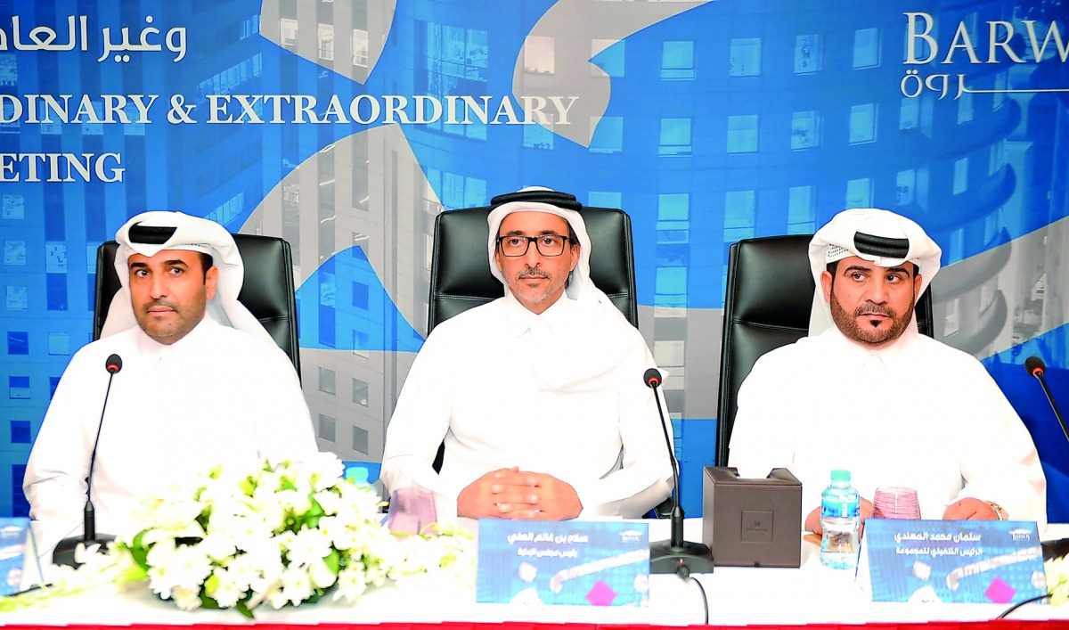 Salah bin Ghanem Al Ali, (centre), Chairman, Barwa Real Estate Group; with Issa Mohammed Al Mohannadi (left), Vice Chairman of the Group; and Salman Mohammed Al Mohannadi, Group CEO during the Ordinary and Extraordinary  General assembly meeting, here, ye