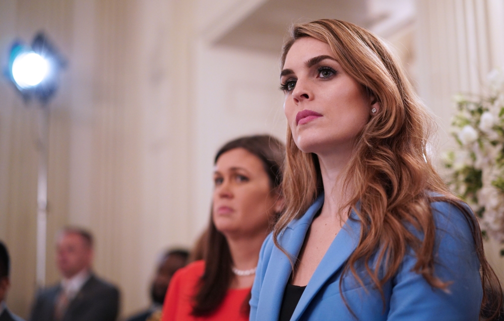 (FILES) In this file photo taken on February 21, 2018 White House Communications Director Hope Hicks watches as US President Donald Trump takes part in a “listening session” on gun violence with teachers and students in the State Dining Room of the White 