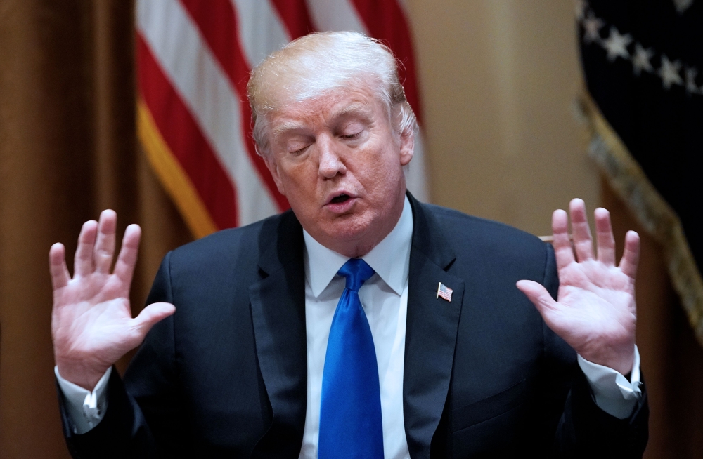 US President Donald Trump speaks during a meeting with bipartisan members of Congress on school and community safety in the Cabinet Room of the White House on February 28, 2018 in Washington, DC. AFP / Mandel Ngan 