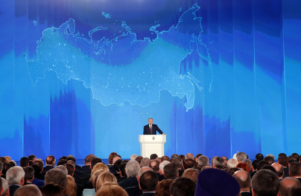 Russian President Vladimir Putin addresses the Federal Assembly, including the State Duma parliamentarians, members of the Federation Council, regional governors and other high-ranking officials, in Moscow, Russia March 1, 2018. REUTERS/Maxim Shemetov 
