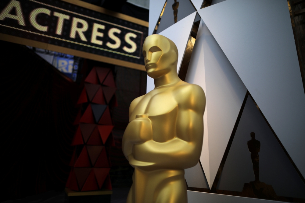 An Oscar statue is seen outside the Dolby Theatre during preparations for the Oscars in Hollywood, Los Angeles, California, U.S. March 3, 2018. REUTERS/Lucy Nicholson
