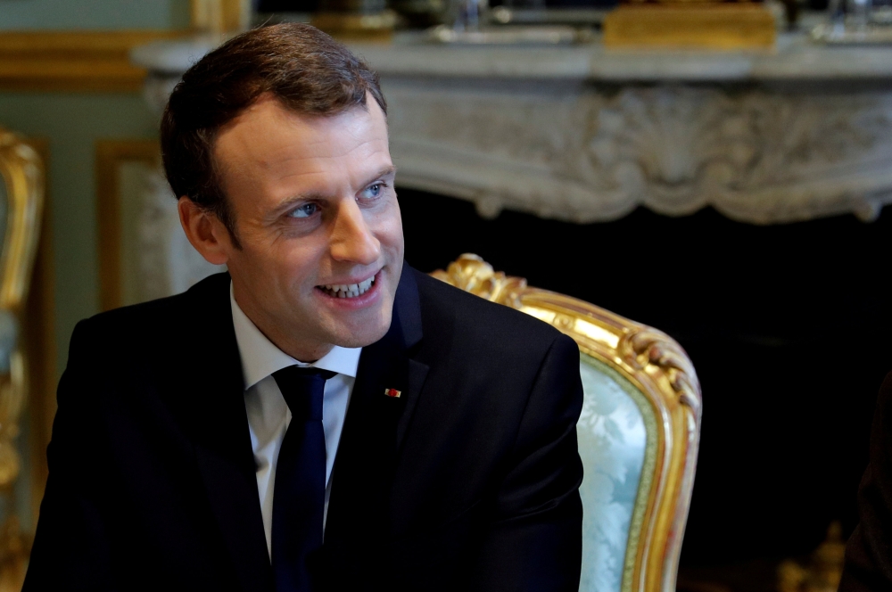 FILE PHOTO: French President Emmanuel Macron attends a meeting at the Elysee Palace in Paris, France, December 19, 2017. REUTERS/Philippe Wojazer/File Photo
