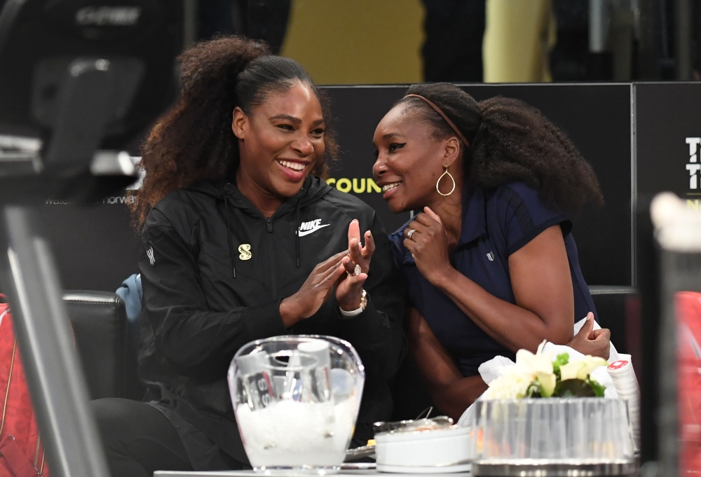 Serena Williams (L) of the US speaks with her sister Venus Williams (R) before their matches in the Tie Break Tens New York tournament at Madison Square Garden March 5, 2018, featuring eight of the tour’s top female players competing for the $250,000 winn