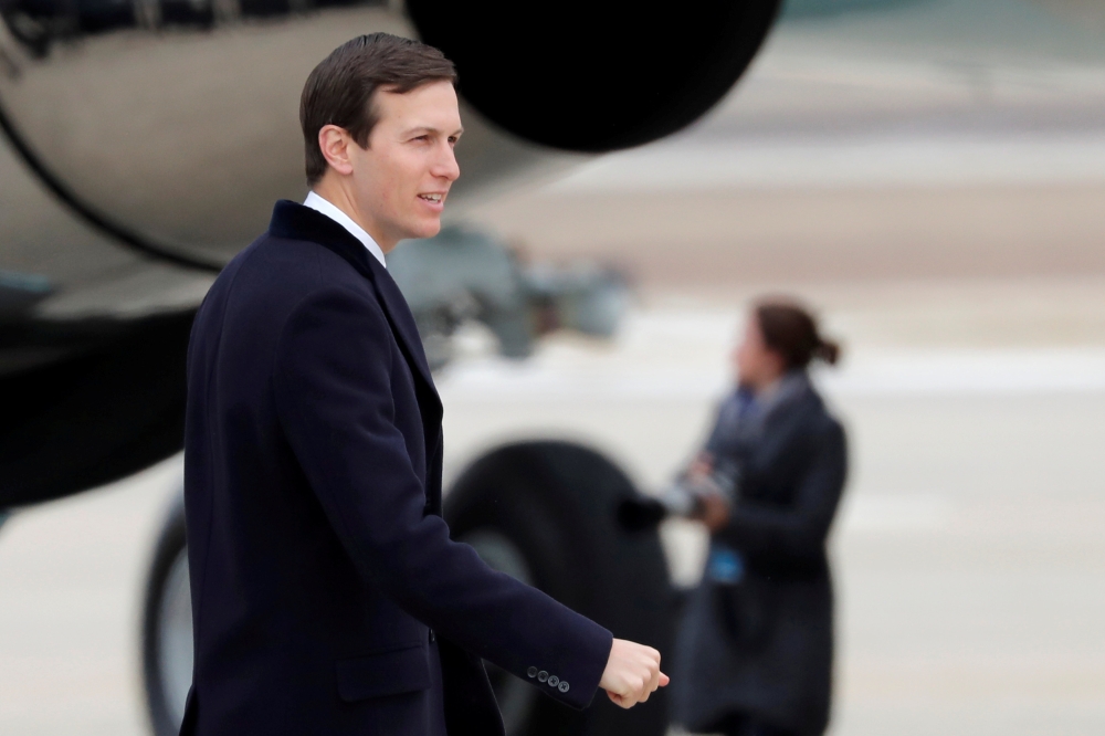 FILE PHOTO: Senior advisor and son-in-law of U.S. President Donald Trump, Jared Kushner, boards Air Force One as he accompanies the president to Nashville, Tennessee from Joint Base Andrews, Maryland, U.S., January 8, 2018. REUTERS/Carlos Barria/File phot
