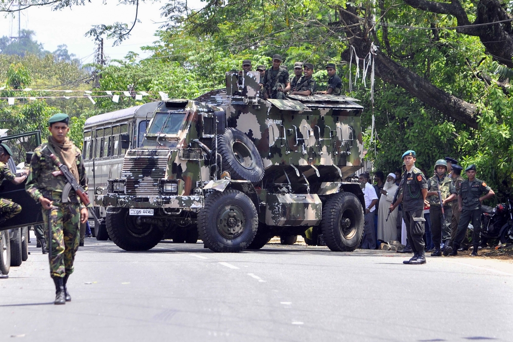 Sri Lankan police commandos patrol on the streets of Pallekele, a suburb of Kandy, on March 6, 2018, following anti-Muslim riots that has prompted the government to declare a state of emergency. AFP