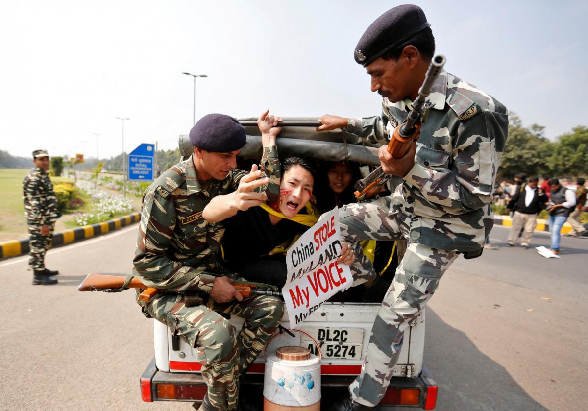 FILE PHOTO: Tibetan activists detained by police in New Delhi, India, March 10, 2017. REUTERS/Cathal McNaughton/File photo
