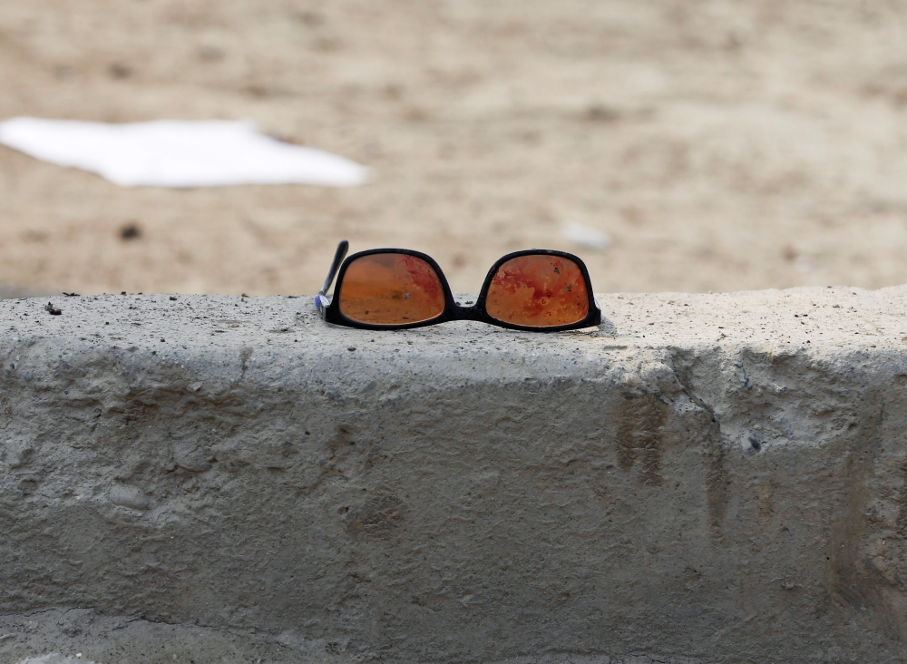 A pair of sunglass with blood is seen at the site of a suicide bomb attack near a Shi'ite mosque in Kabul, Afghanistan March 9, 2018. Reuters/Omar Sobhani


