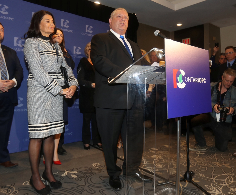 Progressive Conservatives leadership race candidate winner Doug Ford speaks with his wife Karla in Markham, Ontario, Canada, March 10, 2018. REUTERS/Fred Thornhill